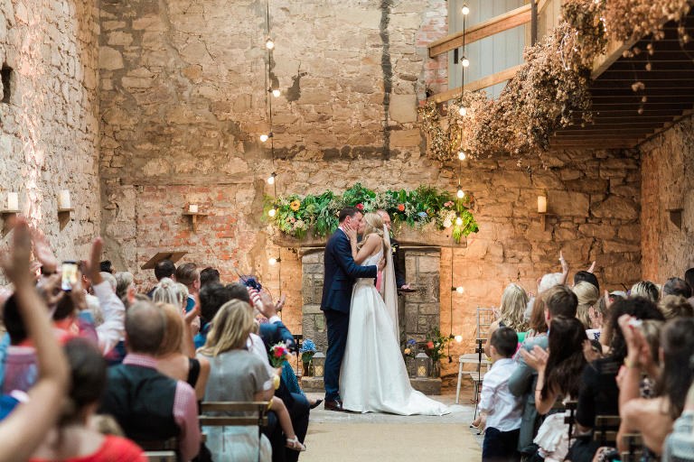 beautiful bride and stylish groom kiss at doxford barns wedding photography